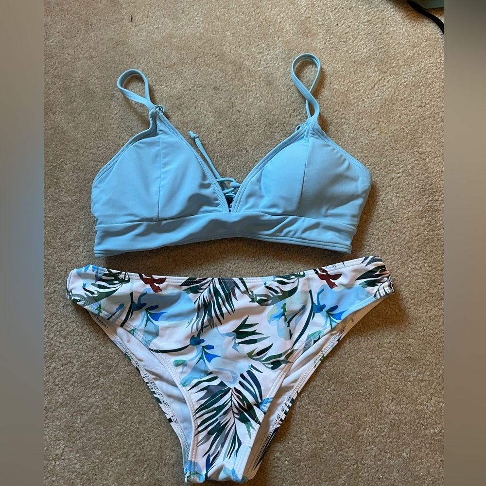I am selling this bathing suit set. It is a size medium